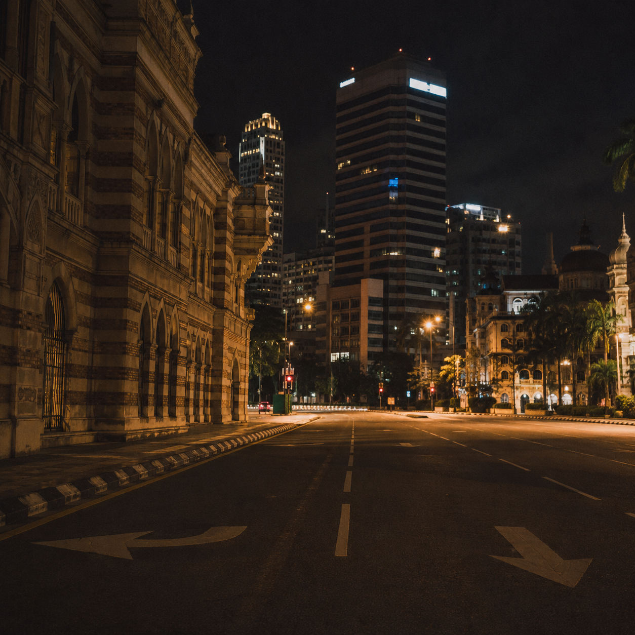 Empty Malaysian city street at night, deserted urban road, atmospheric street lighting, no crowds, film grain